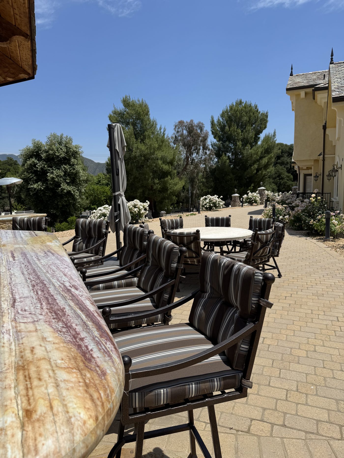 Row of outdoor bar chairs with custom cushions
